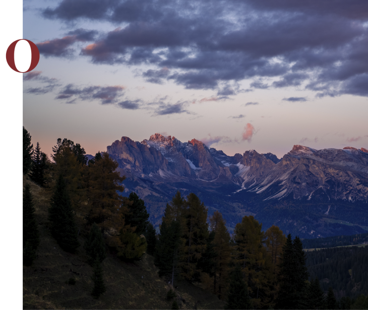 Rifugio Molignon Alpe di Siusi | Esperienze alpine pure L'immagine mostra un gruppo montuoso.